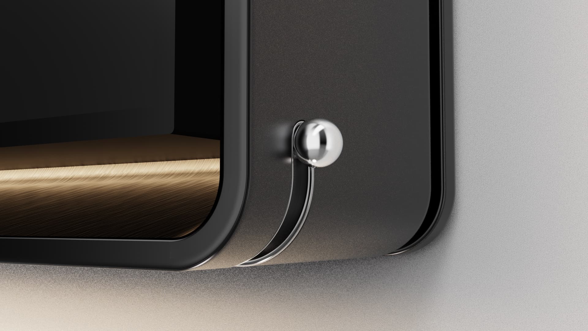 Close-up of the Spine's anodised aluminium corner, side switch, and the album art on its display.