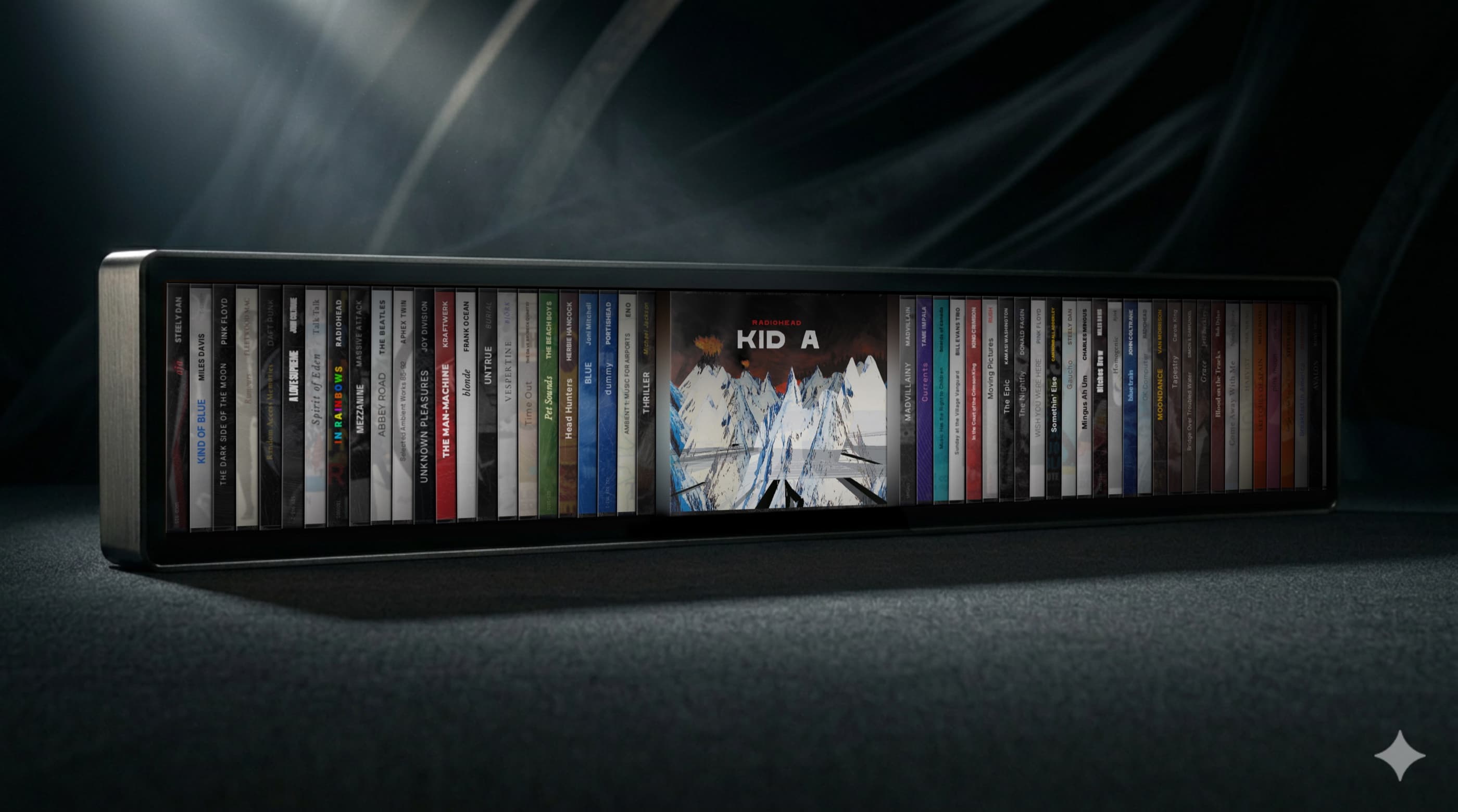 Spine bar-format wall display shown in full — brushed aluminum end caps, matte black border, an assortment of album spines with Radiohead's Kid A cover expanded on screen. CGI render, not final product.