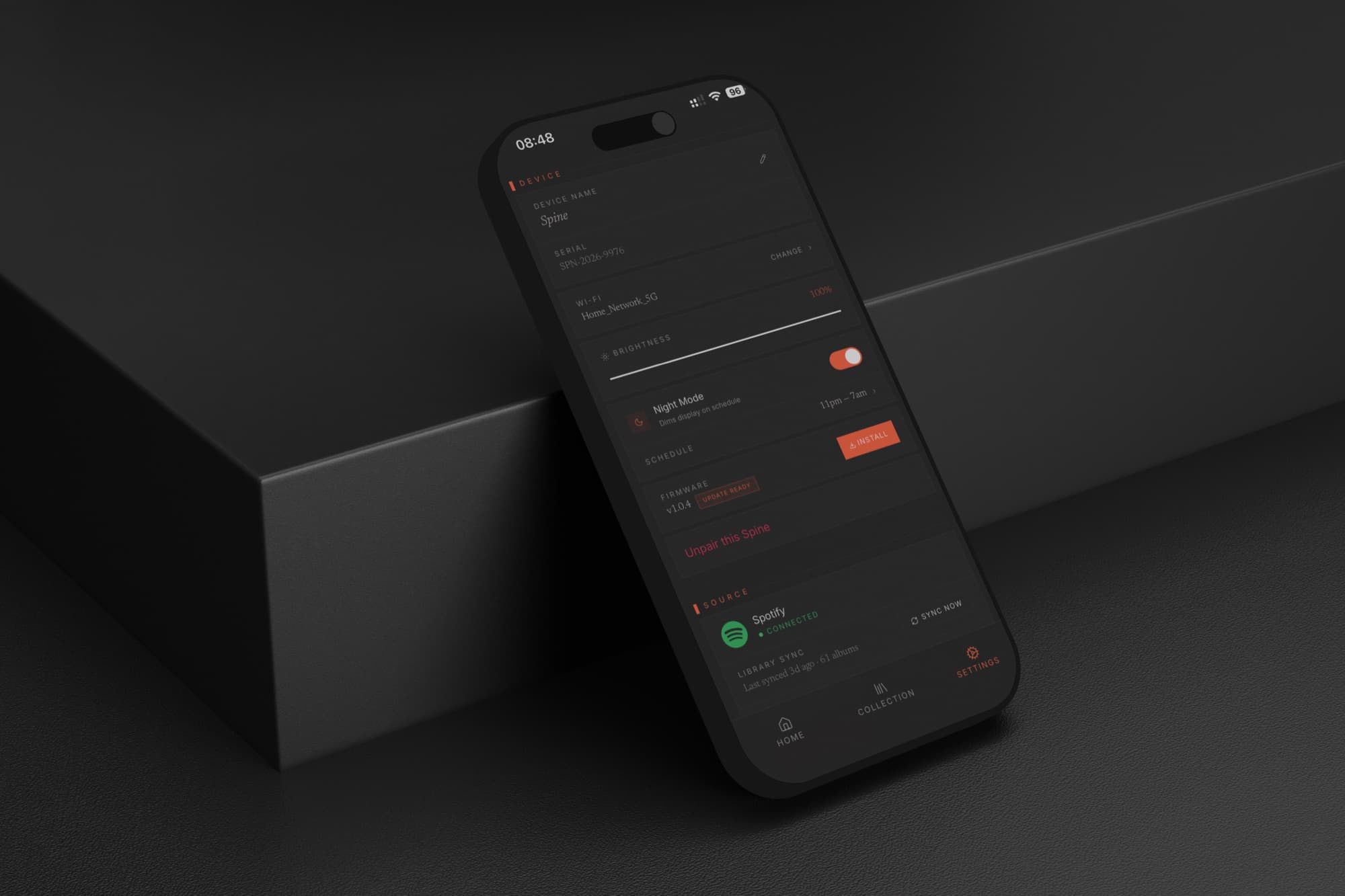 Spine Music app Settings screen showing device name, serial, Wi-Fi network, brightness slider, Night Mode schedule, firmware update, and the connected Spotify source.